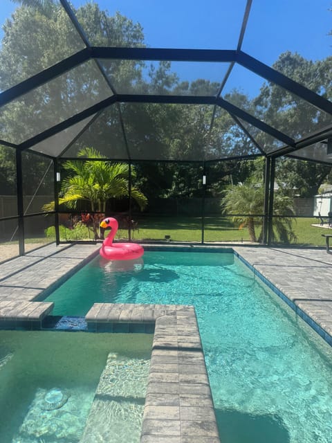 Relax in the private salt pool & hot tub. The screened lanai keeps mosquitos out