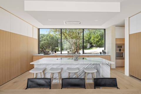 Bright and open concept kitchen with bar seating for four people