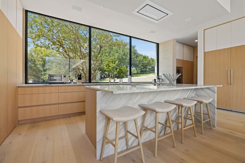 Kitchen area with bar seating for four people for the perfect spot to sip on your morning coffee