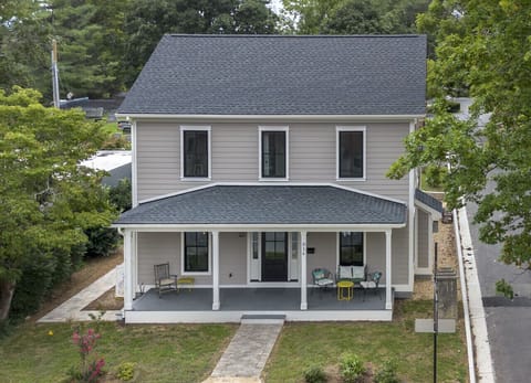 Exterior view of the home featuring a separate private entrance to the first-floor space
