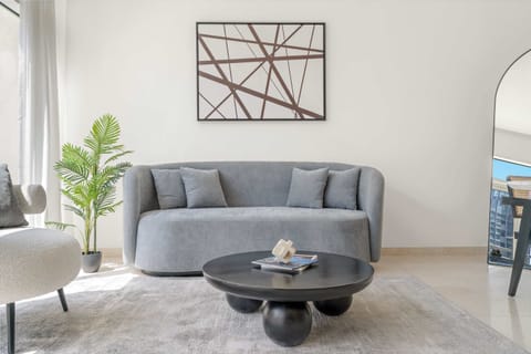 Bright living area w/ cozy sofa & stylish decor for easy lounging