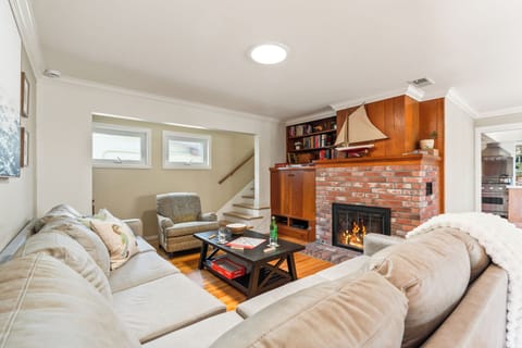 Cozy living room with fireplace and sectional seating.