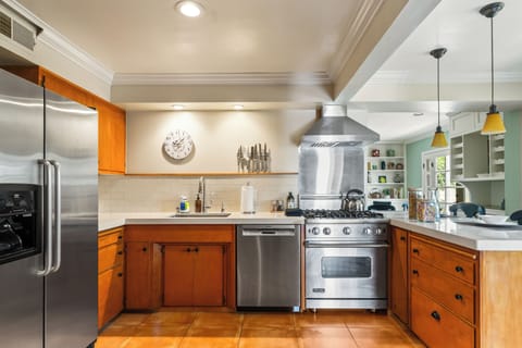 Modern kitchen with stainless steel appliances.