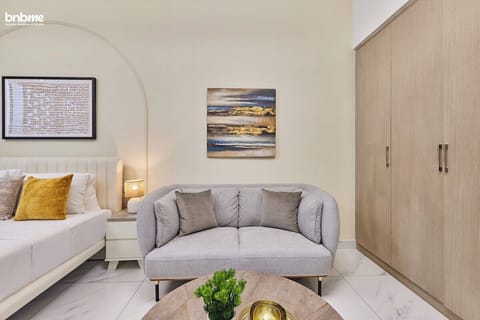 Relax in this well-designed bedroom with a plush king-sized bed, a sofa bed for additional comfort, and a TV for your entertainment.
