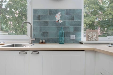 A kitchen with a island and bar chairs is ideal for cooking and feasting together.