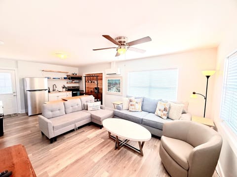 Open concept living, dining, kitchen area. Couch provides additional sleeping for 1.