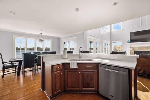 kitchen island open to dining and living