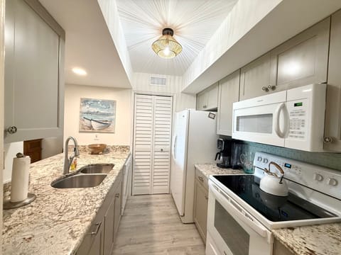 Our newly renovated kitchen features new appliances and ample counter space, making meal prep a joy!