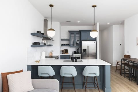 Condo 1 - Fully-stocked kitchen for all your cooking needs! There is also a separate high-top dining table with seating for 4.