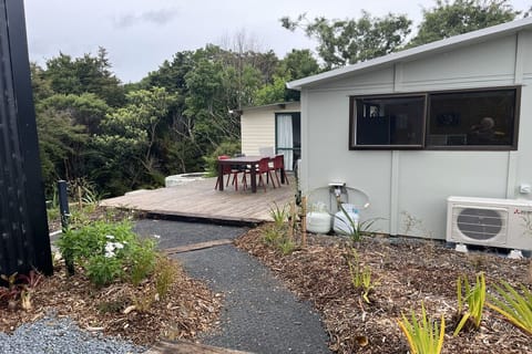 Entry path to rear deck, living shed and twin cabin
