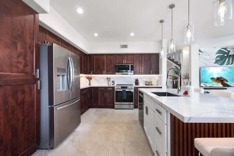 Modern kitchen with island and stainless steel appliances