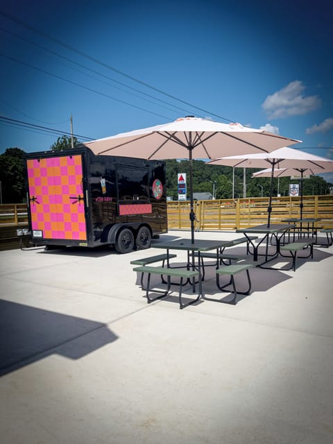 Public patio area with varying food trucks each month