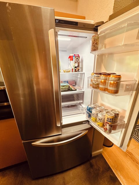 Huge, new French door fridge with built-in ice maker and tons of storage. 