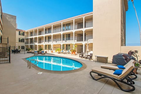 Communal pool with plenty of seating and lounge chairs.