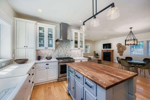 Bright kitchen stocked with cookware, utensils, and appliances, perfect for long-term stays