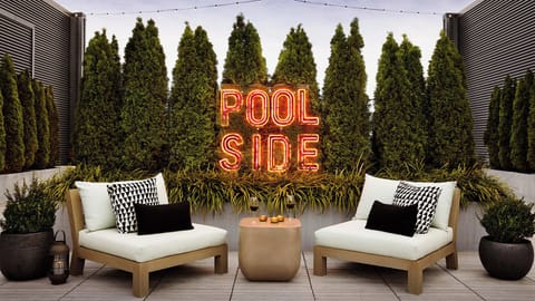 Sip and socialize in a chic rooftop poolside lounge.