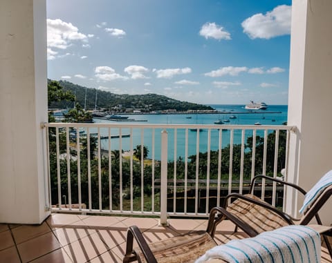 Relax on your private balcony and soak in peaceful Caribbean harbor views.