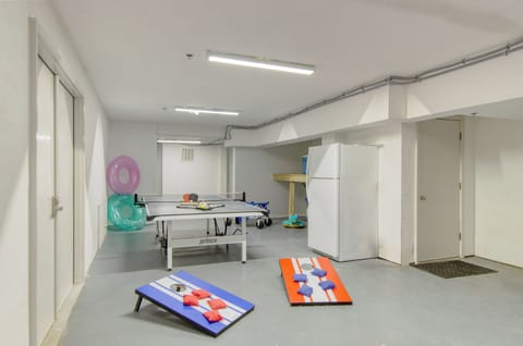 Game room with cornhole and ping pong. (Coastal Marsh)