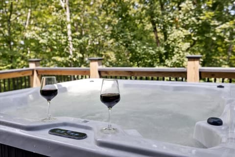 Unwind in the private hot tub while soaking in peaceful lake views and fresh mountain air.