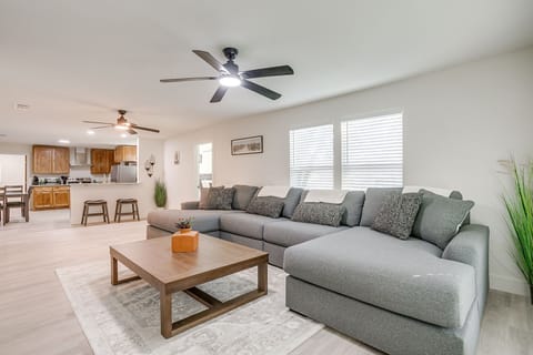 Enjoy a large sectional sofa in a bright, airy living space — perfect for movie nights or game day with Smart TV included.