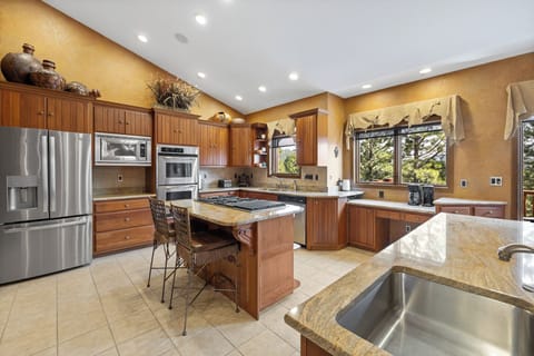 Luxury kitchen equipped with open layout, ideal for group meals and gatherings.