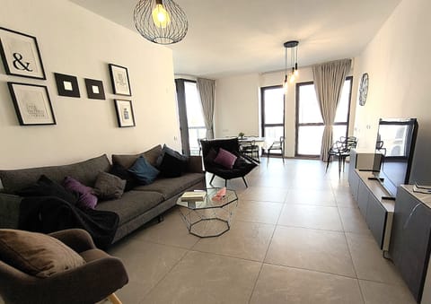 Living Room With TV and Views of Yafo Street
