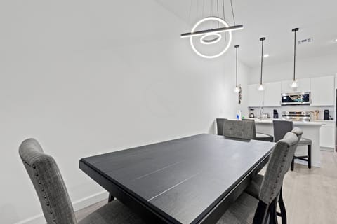 Enjoy every meal with a relaxing view of the private pool and patio