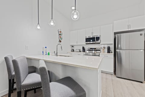 Cook your favorite meals using stainless-steel appliances and spacious counters.