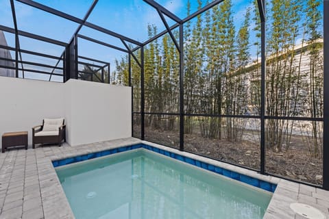 Enjoy sunny Florida days by your private pool surrounded by a wide patio and comfortable lounge chairs.