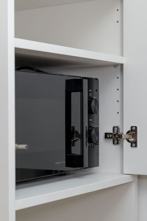 Bright kitchen with cooking utensils.