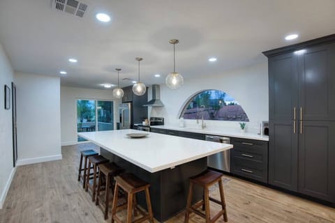 Chef's paradise. Modern kitchen with sleek finishes and ample space for cooking.