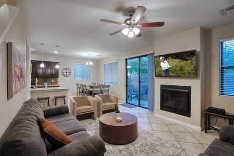 Cozy living room with HD TV, electric fireplace and plenty of seating.