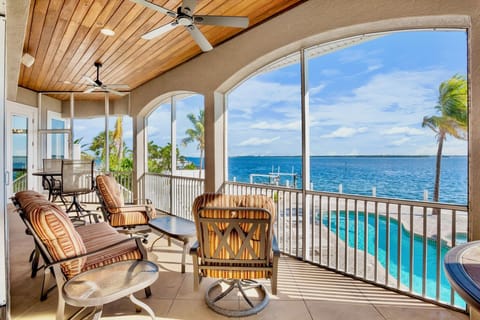 Balcony with dining table and chairs