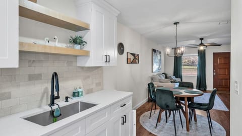 A spacious deep sink and cozy dining area, perfect for cooking and relaxing. Ideal for enjoying meals and creating lasting memories during your stay.