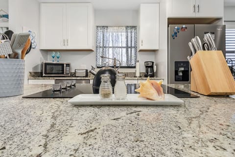 Fully equipped kitchen with updated appliances and everything you need to cook at home.