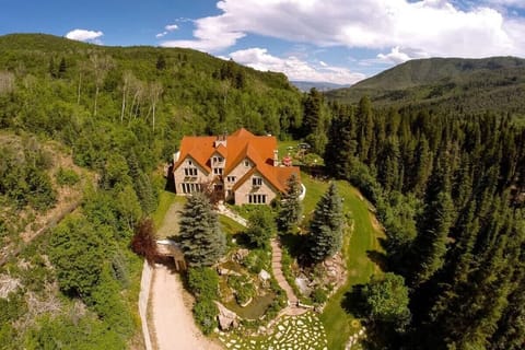 Discover luxury in Midway, UT with this elegant estate nestled in lush woodlands. Enjoy privacy, modern amenities, and breathtaking nature views for a serene getaway.