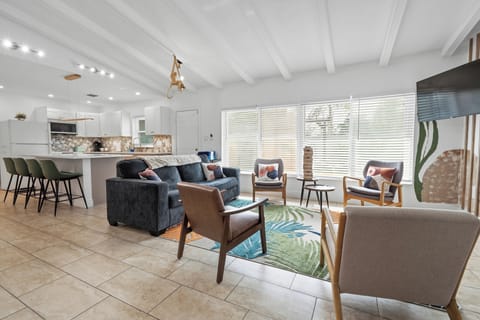 A vibrant St. Pete beach–inspired space where the kitchen and gathering room com