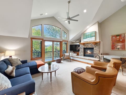 Sink into plush seating around the gas fireplace while mountain views fill the glass doors to your private balcony. Game night at the dedicated table or movie night on the 55` smart TV - your cozy gathering hub awaits