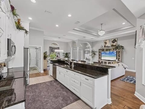 Bright, fully-equipped kitchen with lots of countertop and storage space