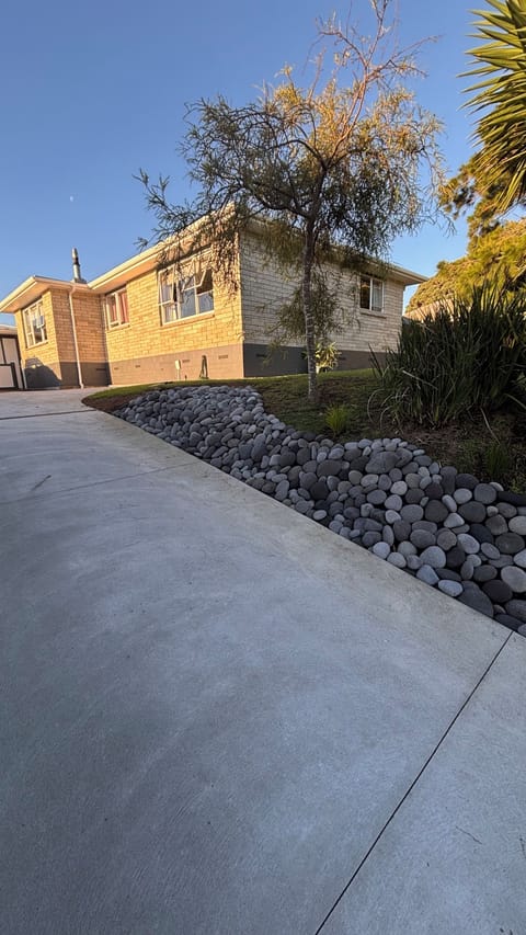 Looking from driveway up to house