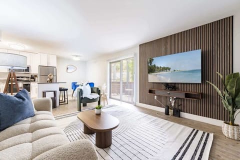 A refined open-plan layout featuring designer finishes, custom details, and a serene, contemporary vibe. An effortless flow between living, dining and kitchen