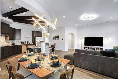 Spacious dining table that sits 6 with full tableware and silverware included. 