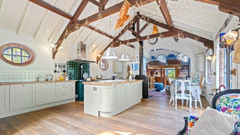 Sitting beneath the exposed beams above, the kitchen has more than enough space to unpack your essentials.