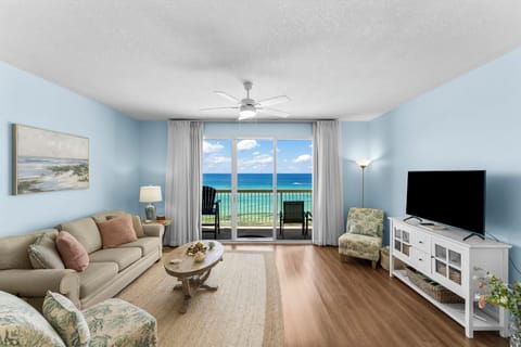 Relax in this coastal living room with ocean views and natural light.