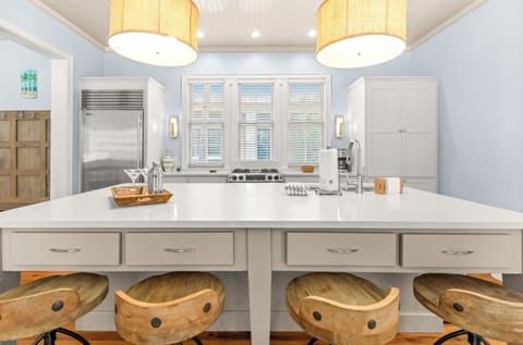 Kitchen with large island allows multiple people to cook together