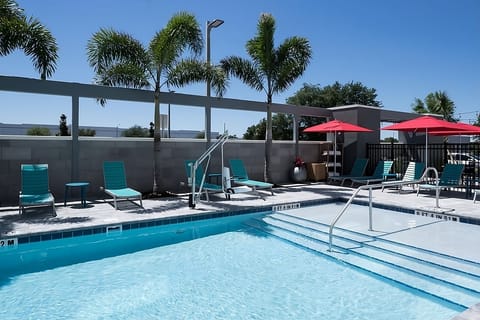 Dive into sunshine and unwind poolside under swaying palms.