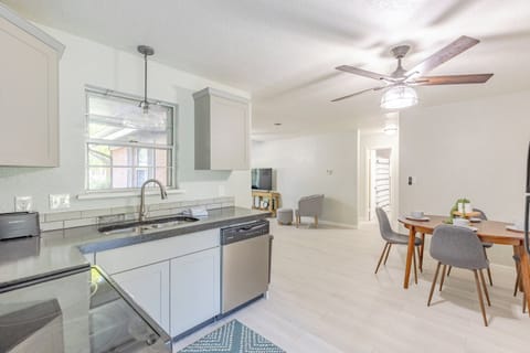 Bright kitchen featuring a cozy table set for four guests.