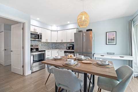 A lovely dining area seamlessly in touch with the kitchen.