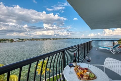 Sip wine on the balcony as the bay sparkles.