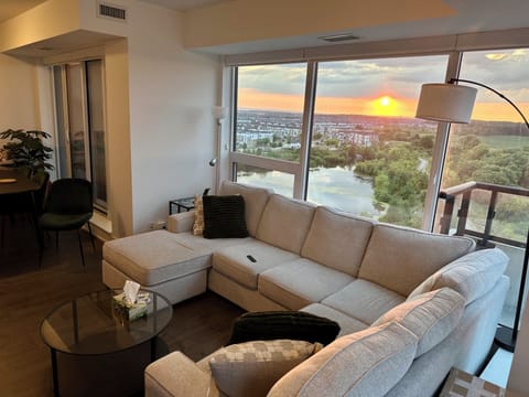 Spacious living room with sectional sofa, coffee table, side table, and lamps.